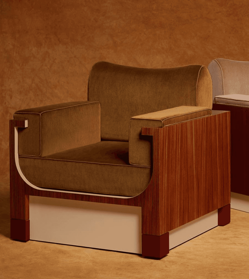 A modern upholstered armchair featuring a striking rectilinear wood frame with contrasting velvet cu… — 3D model