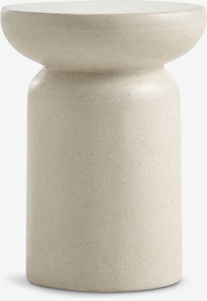 A cylindrical, hourglass-shaped furniture piece in a light speckled finish, resembling cement or ter… — 3D model