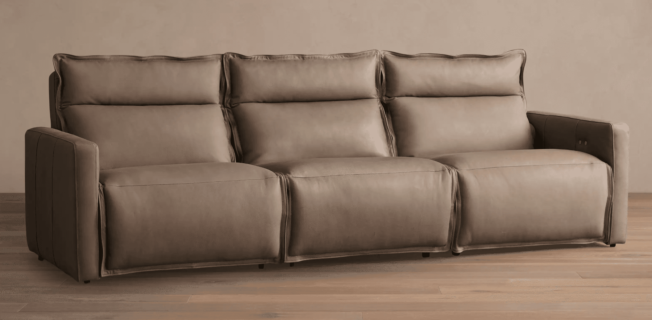A three-seater recliner sofa upholstered in taupe-colored leather. The sofa features plush, overstuf… — 3D model