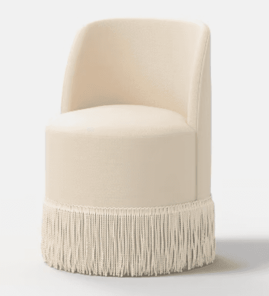 A cream-colored, cylindrical upholstered accent chair featuring a low, curved backrest and a distinc… — 3D model