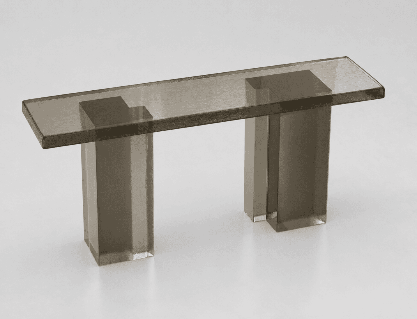 A console table with a rectangular top supported by two rectangular prism legs. The table appears to… — 3D model