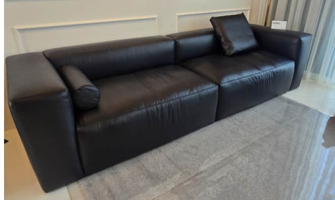 A contemporary black sectional sofa, comprising at least two modular segments, upholstered in what a… — free SKP 3D model
