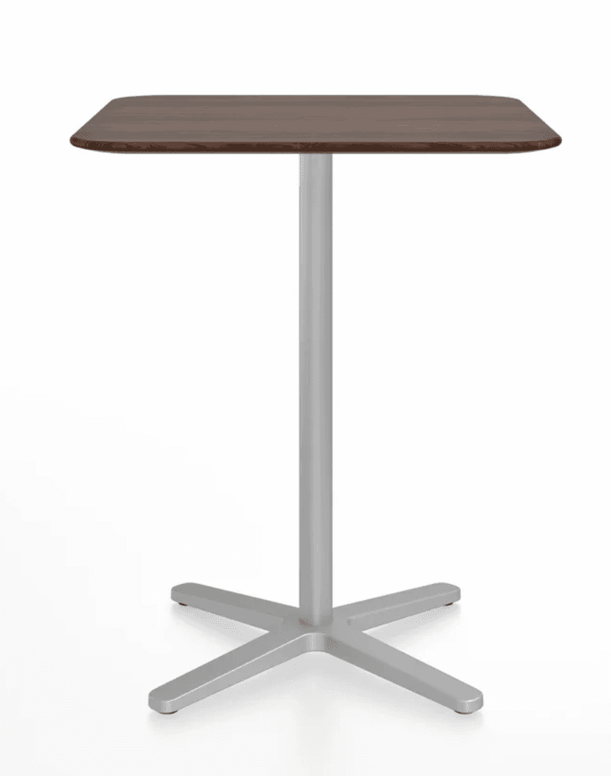 A modern square-top table with rounded corners, featuring a dark wood grain finish, supported by a s… — 3D model