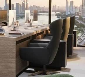 A modern armchair with a high, curved backrest and a plush seat. It features a swivel base with four… — free OBJ 3D model
