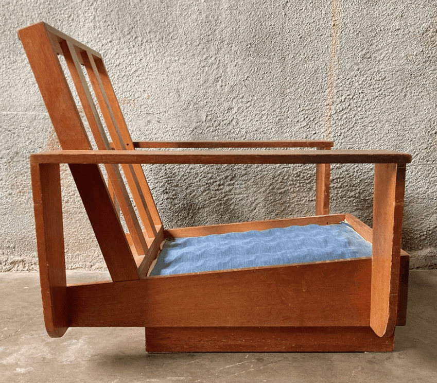A wooden armchair with a slatted backrest and a light blue upholstered seat cushion. The armchair fe… — free OBJ 3D model