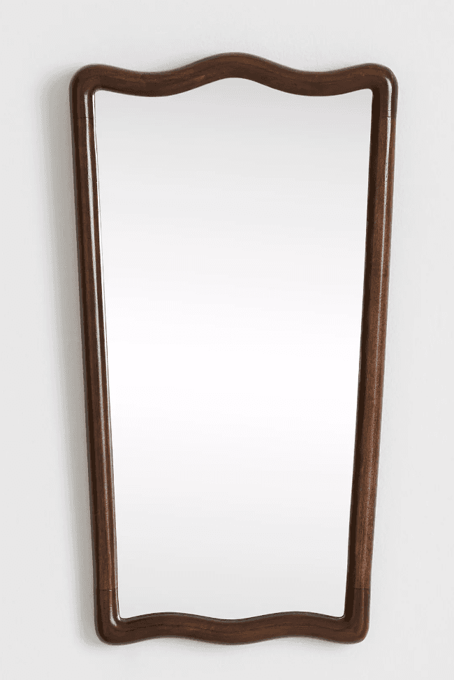 A wall-mounted mirror with a distinctively shaped frame. The frame exhibits a scalloped or wavy patt… — free BLEND 3D model