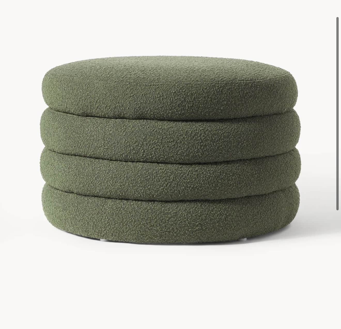 A circular ottoman composed of four stacked, cushioned sections. The ottoman has a textured, boucle-… — 3D model