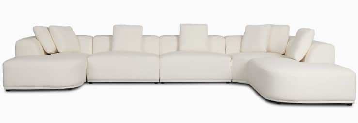 A large, contemporary modular U-shaped sectional sofa upholstered in a cream-colored fabric, featuri… — 3D model