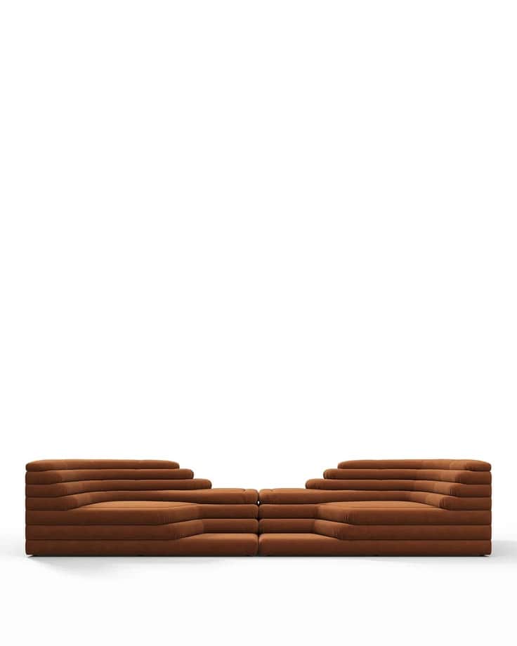A modular sofa with a stepped, layered design. The sofa is upholstered in a textured fabric and feat… — free GLTF 3D model