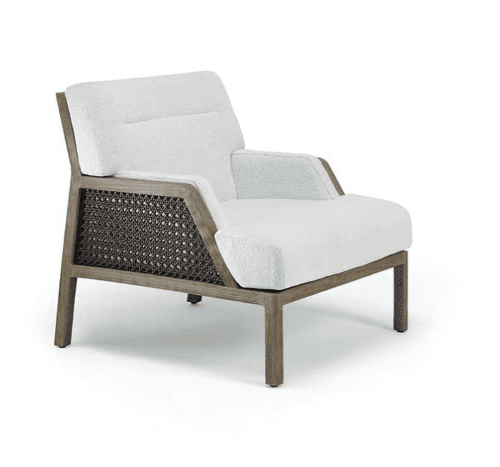 A modern armchair featuring a robust wooden frame with intricate woven cane panels on its sides. The… — 3D model