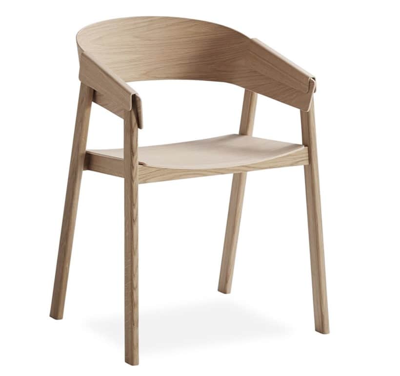 A modern armchair with a gently curved backrest and armrests, supported by four tapered legs. The se… — 3D model