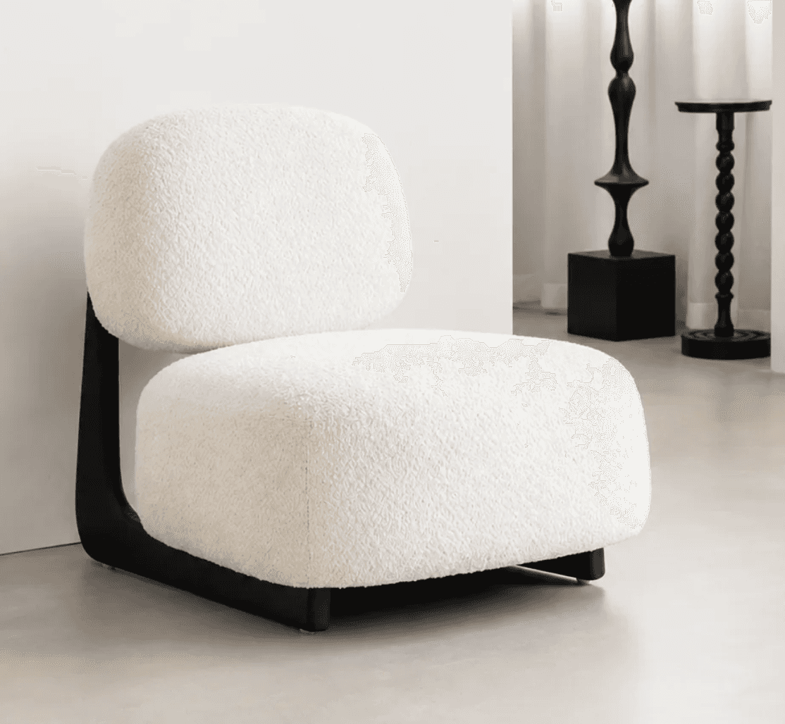 An armless, low-profile lounge chair featuring soft, rounded forms and upholstered in a textured off… — 3D model