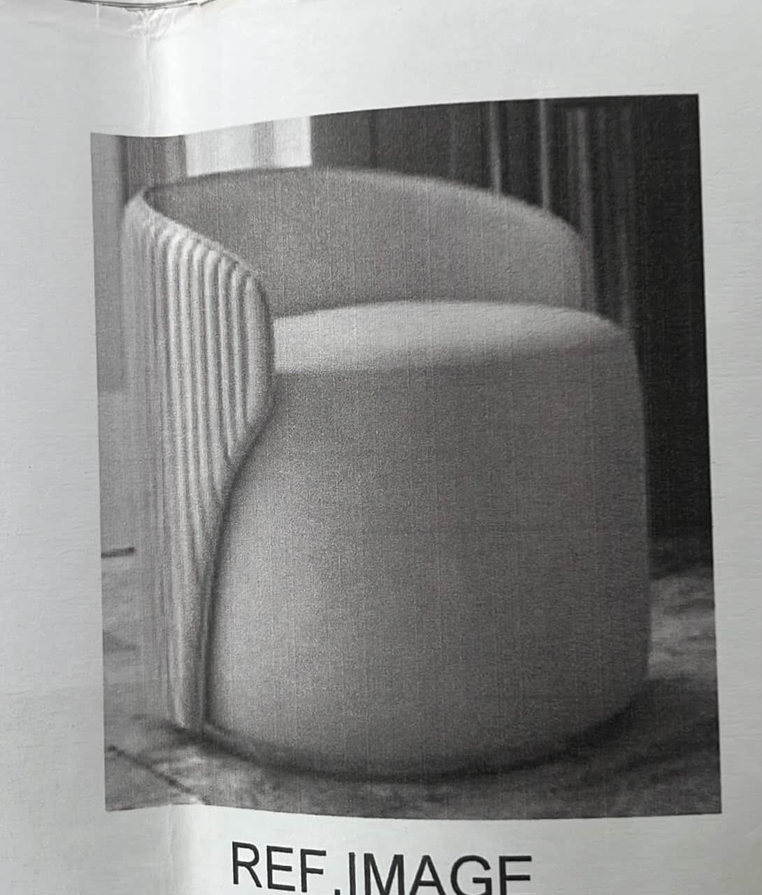 A modern, barrel-shaped accent chair upholstered in a light gray fabric. The chair features a distin… — 3D model