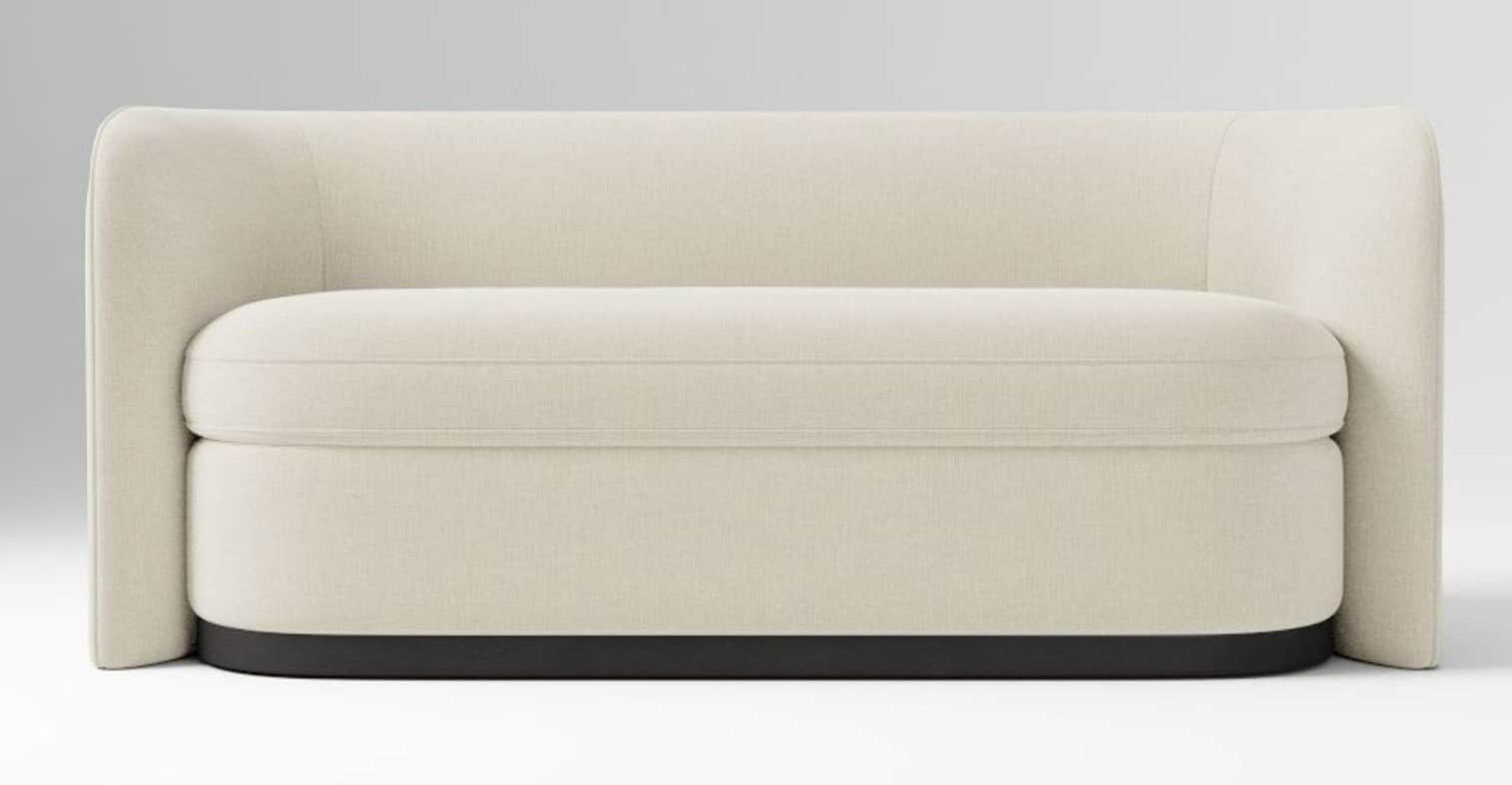 An upholstered loveseat with a modern, low-profile design. It features cream-colored fabric upholste… — 3D model