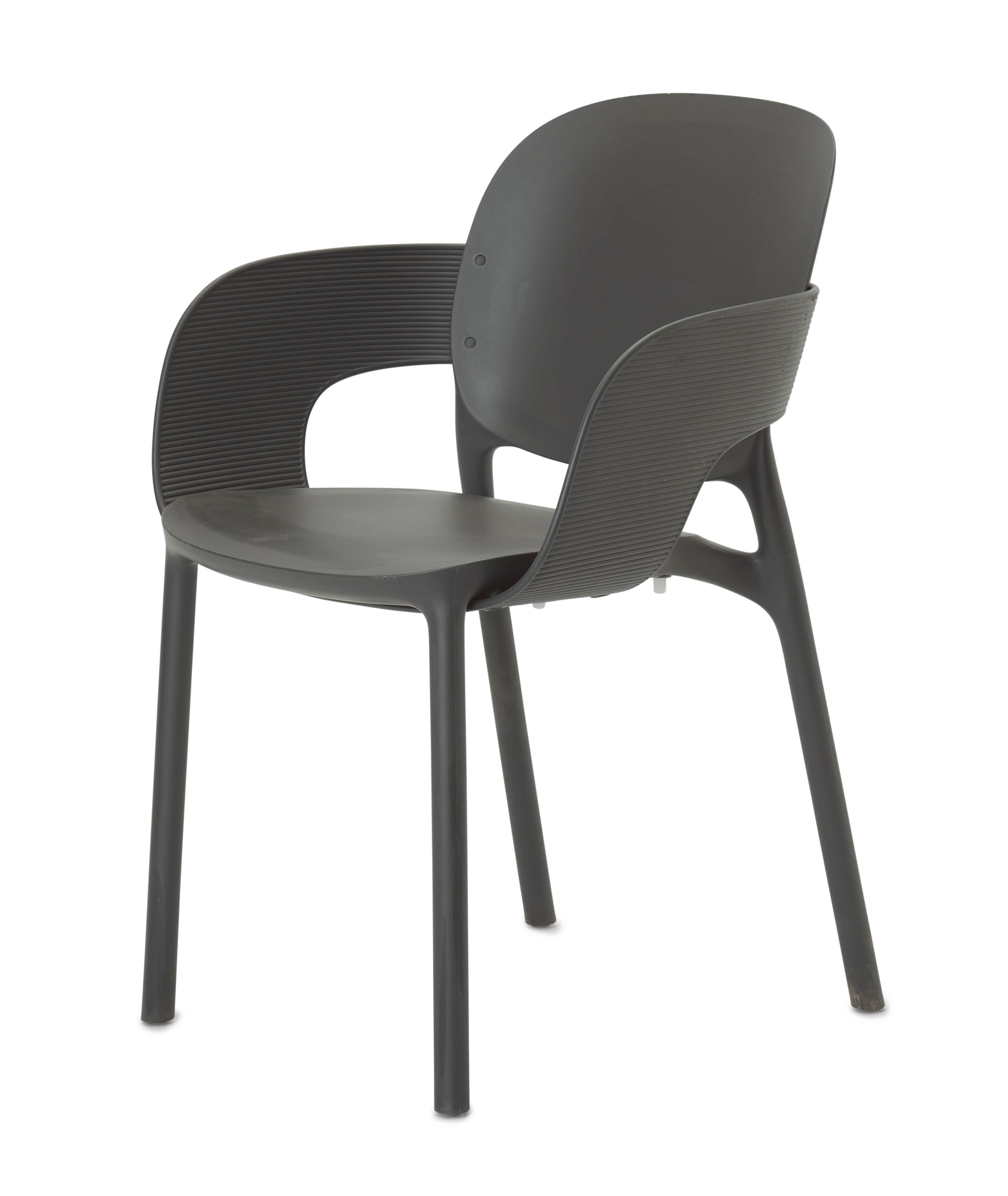 A contemporary dark gray armchair crafted from molded plastic, featuring a single-piece construction… — free OBJ 3D model