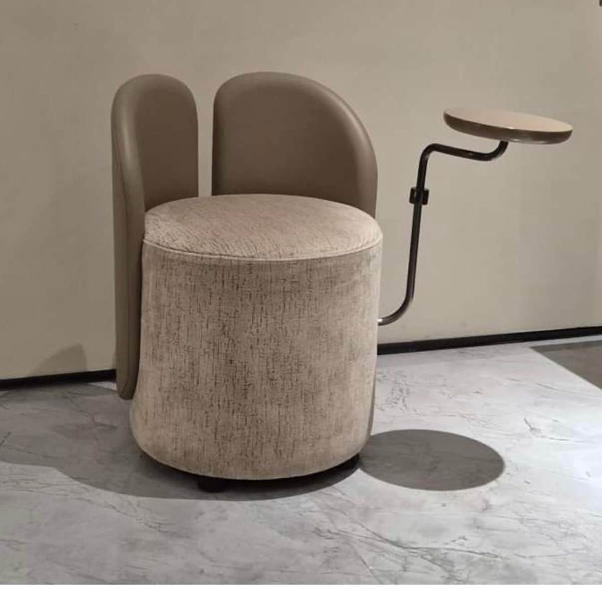 A modern, compact upholstered chair featuring a cylindrical base and seat, twin curved backrest pane… — free OBJ 3D model
