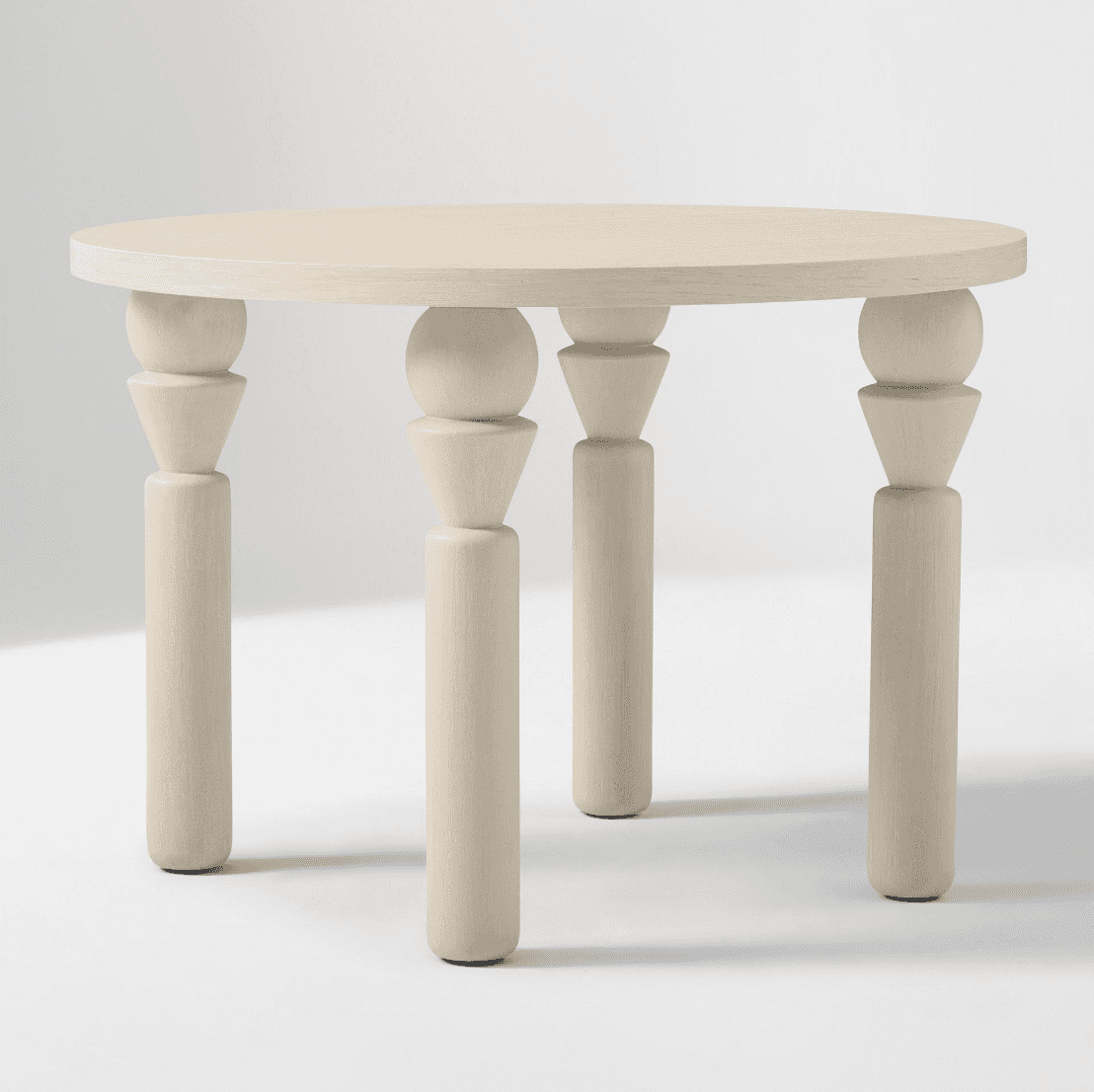 A light-colored round accent table with four sculptural turned wood legs. — 3D model