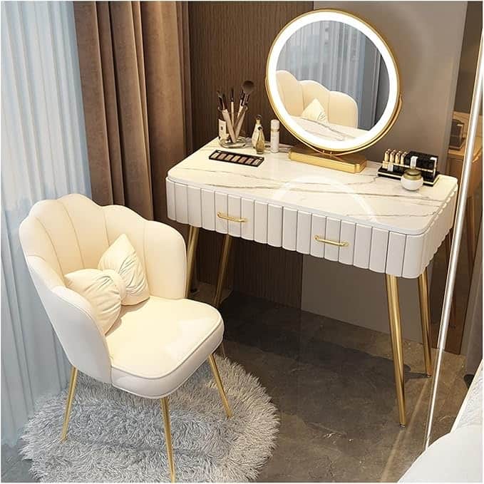 A contemporary cream-colored dressing table with a faux marble top, fluted drawer fronts, and gold-f… — 3D model
