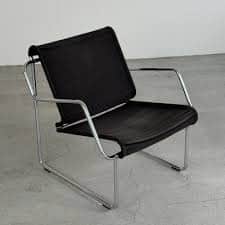 A modern lounge chair featuring a chrome-plated tubular steel frame and a black fabric sling for the… — free OBJ 3D model
