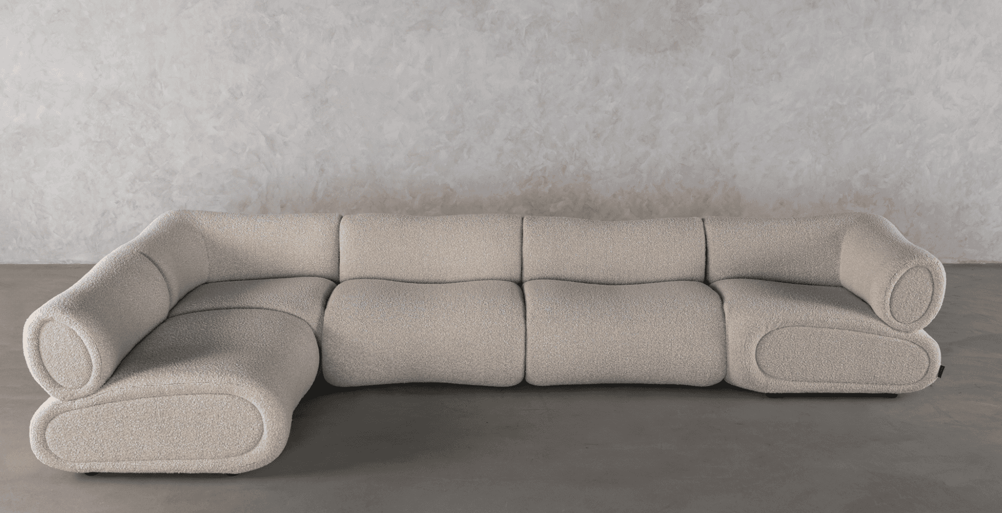 A modern, off-white bouclé fabric sectional sofa composed of multiple modules. It features rounded,… — 3D model