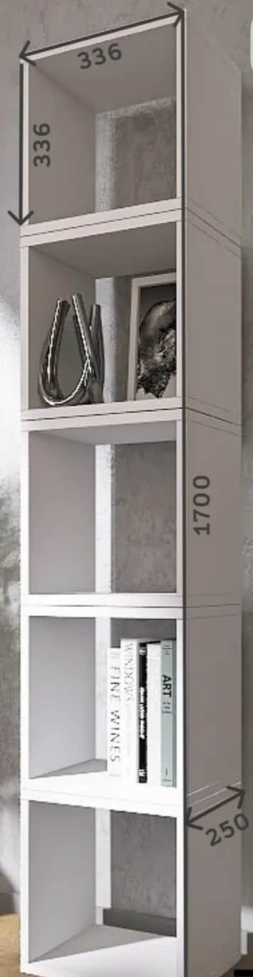 A tall, narrow, white shelving unit with five open cubby compartments, designed for vertical storage… — 3D model