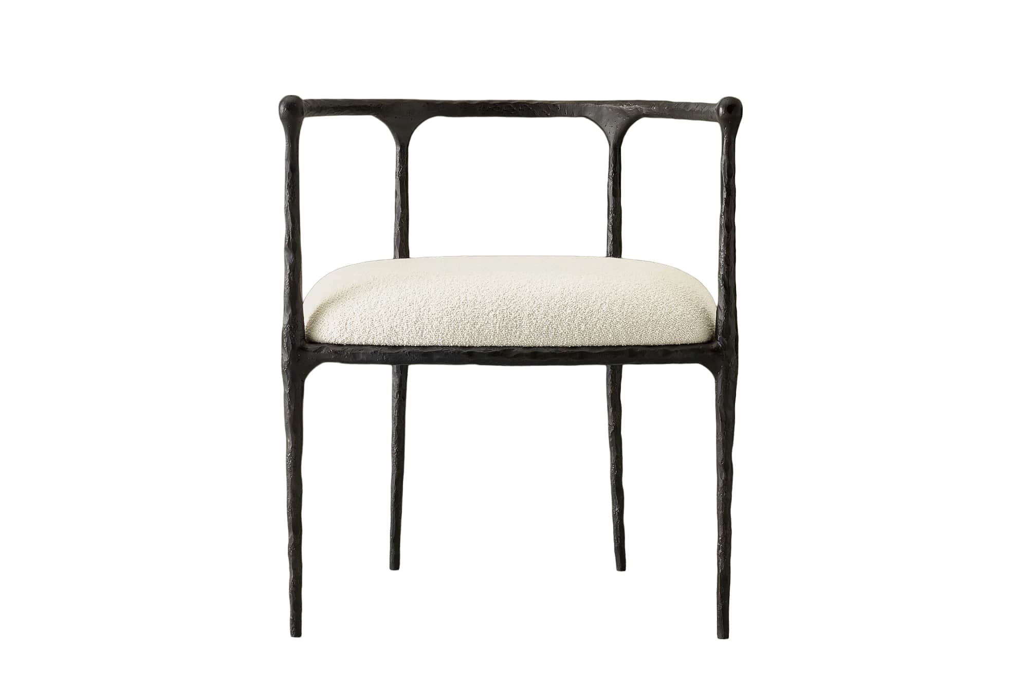 An armchair featuring a dark, heavily textured, and organically shaped cast metal frame paired with… — 3D model
