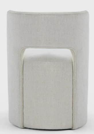 A contemporary fully upholstered barrel-shaped chair featuring a distinct curved back with a central… — free OBJ 3D model
