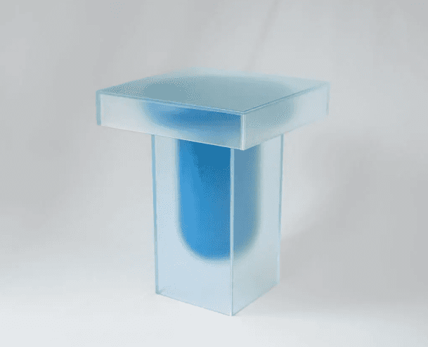 A modern side table with a square top and a rectangular pedestal base. The table features a frosted… — 3D model