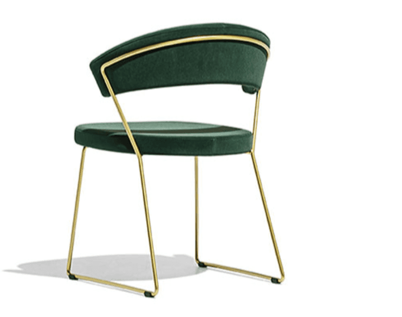 A side chair with a curved backrest and a cushioned seat. The chair features a thin, metallic gold f… — 3D model