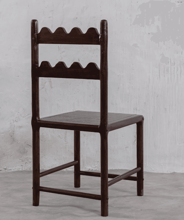 A dark-stained wooden chair featuring a distinctive backrest with two horizontal slats, each carved… — 3D model