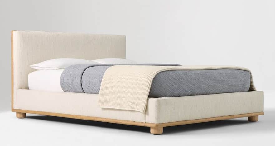 A contemporary bed frame with a fabric-upholstered headboard and base, featuring a visible wooden fr… — 3D model