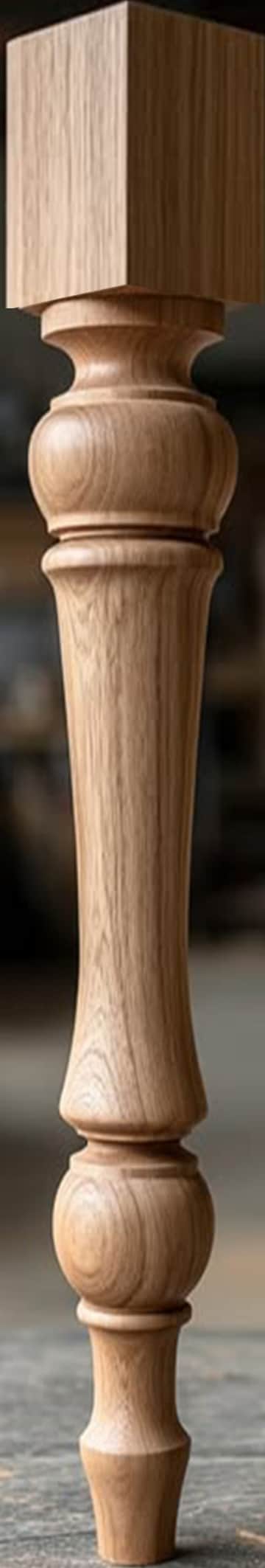 A single turned furniture leg crafted from light-colored oak wood, featuring a traditional design wi… — 3D model