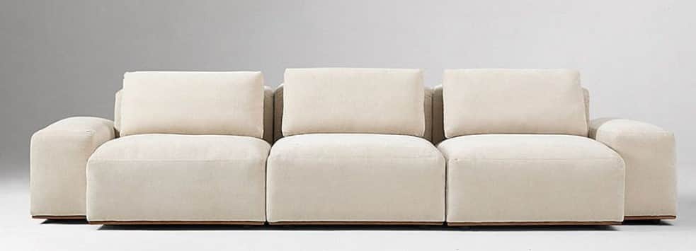 A modular sofa with three distinct seating sections. Each section features a plush, upholstered seat… — 3D model