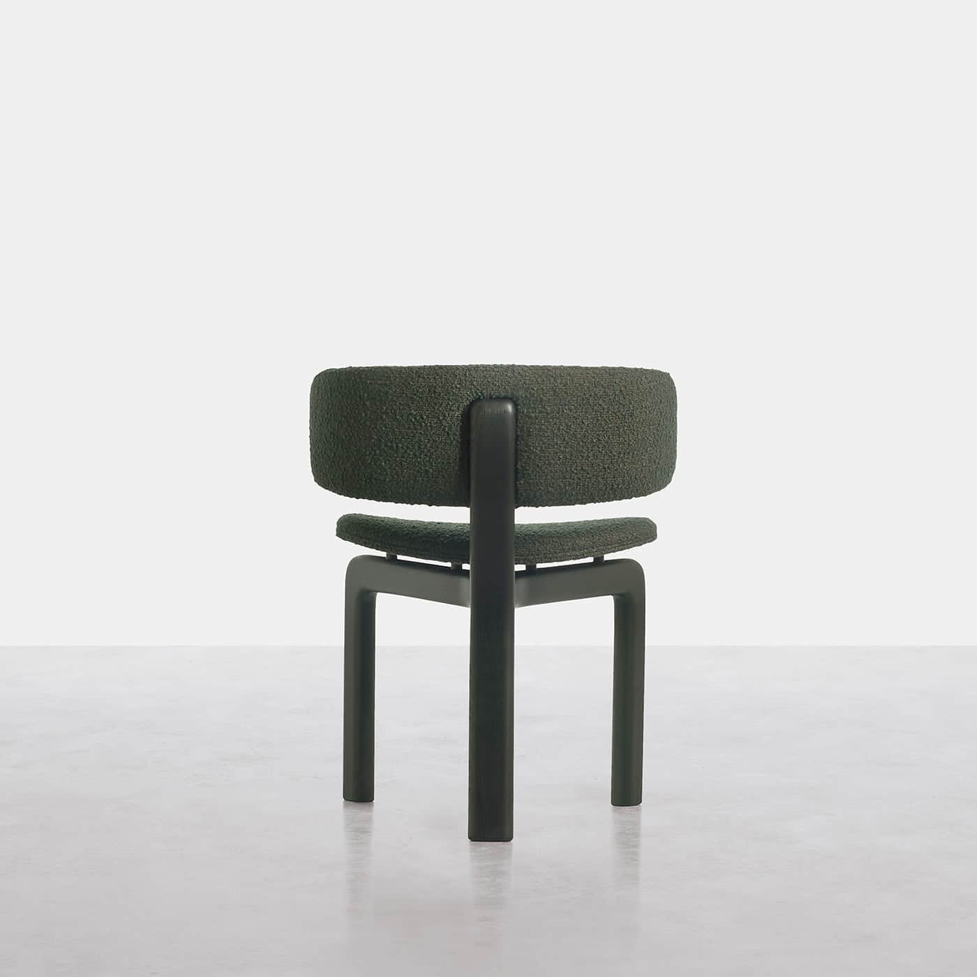 A contemporary armless chair featuring a thick, rounded backrest and seat cushion upholstered in a t… — free STL 3D model