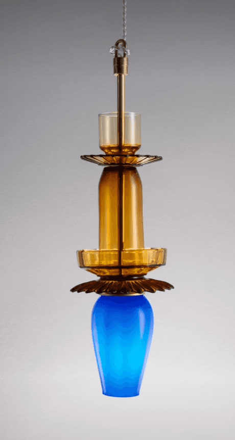 A visually striking pendant light featuring multiple stacked glass elements in amber and blue, accen… — 3D model