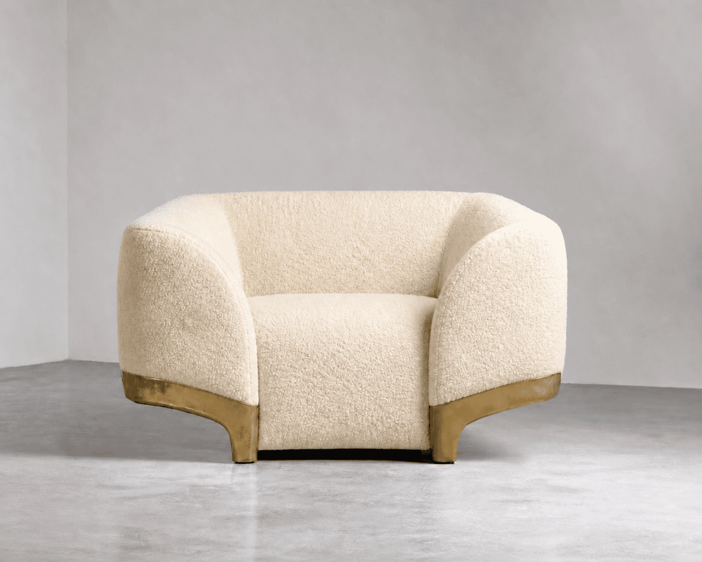 A cream-colored, rounded armchair upholstered in a textured boucle fabric. It features a low profile… — 3D model
