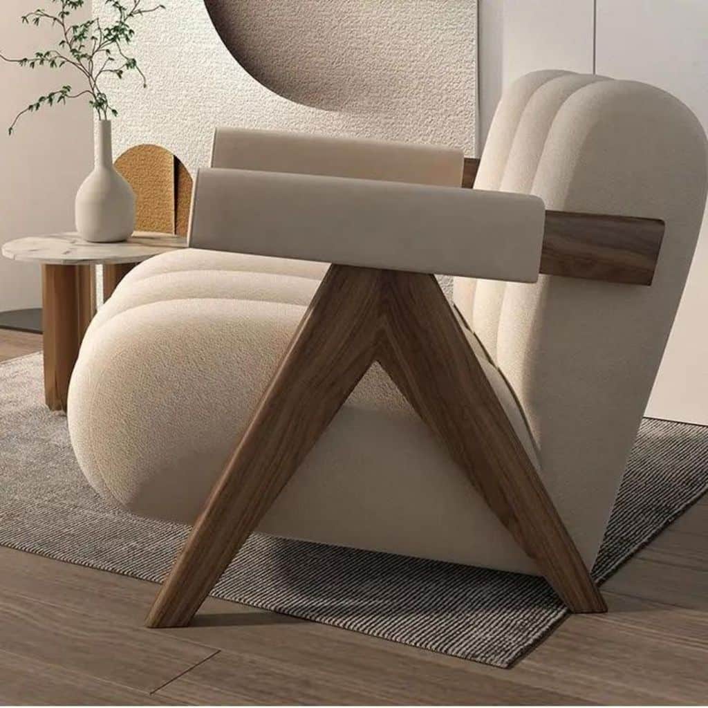 A contemporary armchair featuring deeply fluted cream-colored upholstery and an exposed, angular dar… — 3D model