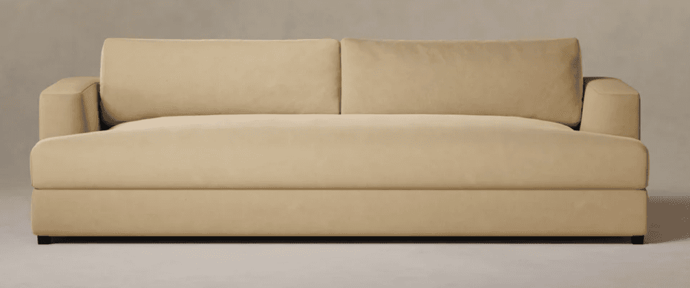 A modern three-seater sofa upholstered in a light beige fabric, featuring track arms and two individ… — 3D model