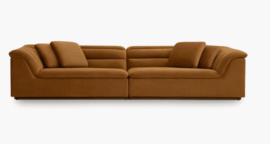 A two-piece modular sofa upholstered in a soft, textured fabric with a warm brown or caramel color.… — free GLTF 3D model