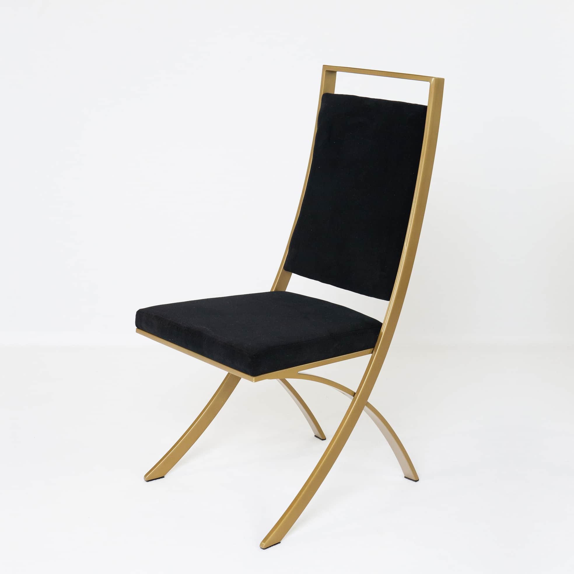 A contemporary dining chair featuring a striking gold-finished metal frame and black upholstered sea… — 3D model