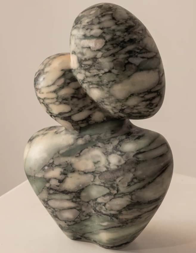 An abstract, biomorphic sculpture made from veined marble. The piece features a curvilinear, organic… — 3D model