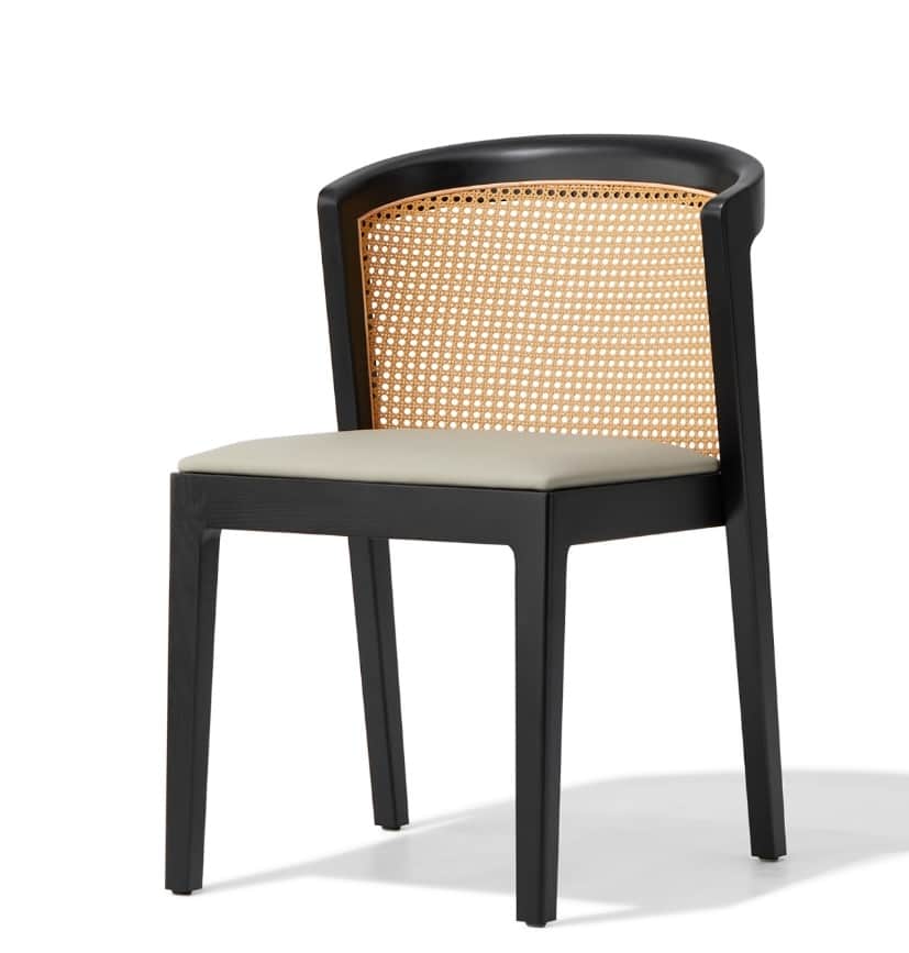 A contemporary dining chair featuring a black-stained solid wood frame, a woven cane backrest, and a… — 3D model
