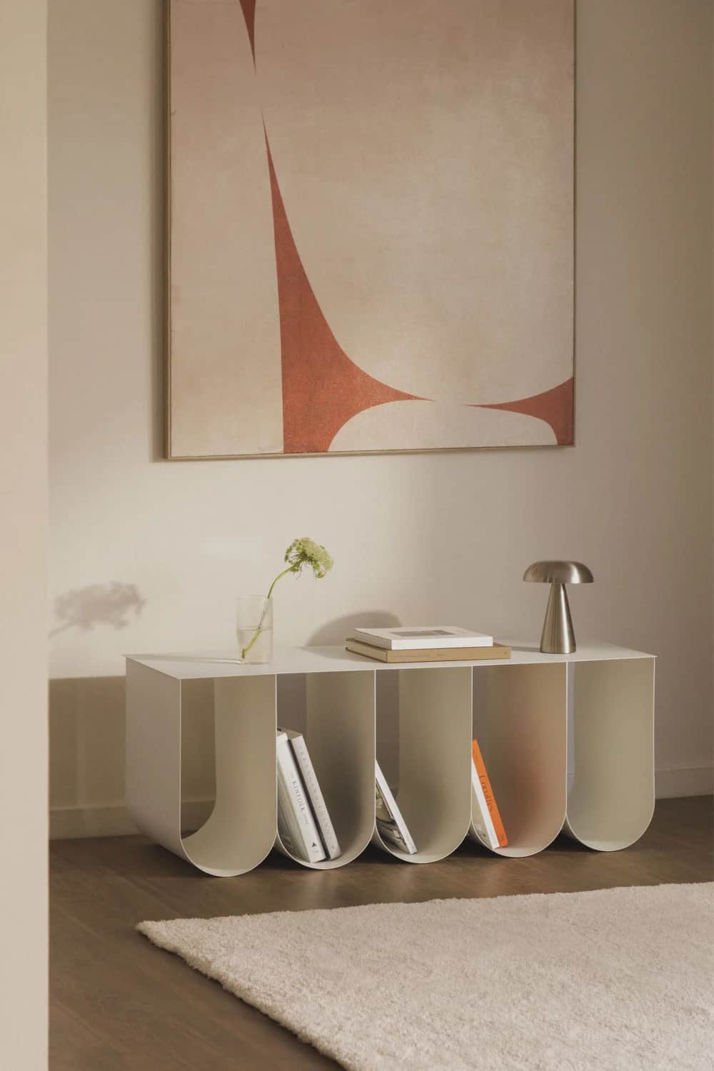 A minimalist, wall-mounted shelf unit with five open compartments. The unit has a clean, rectangular… — 3D model