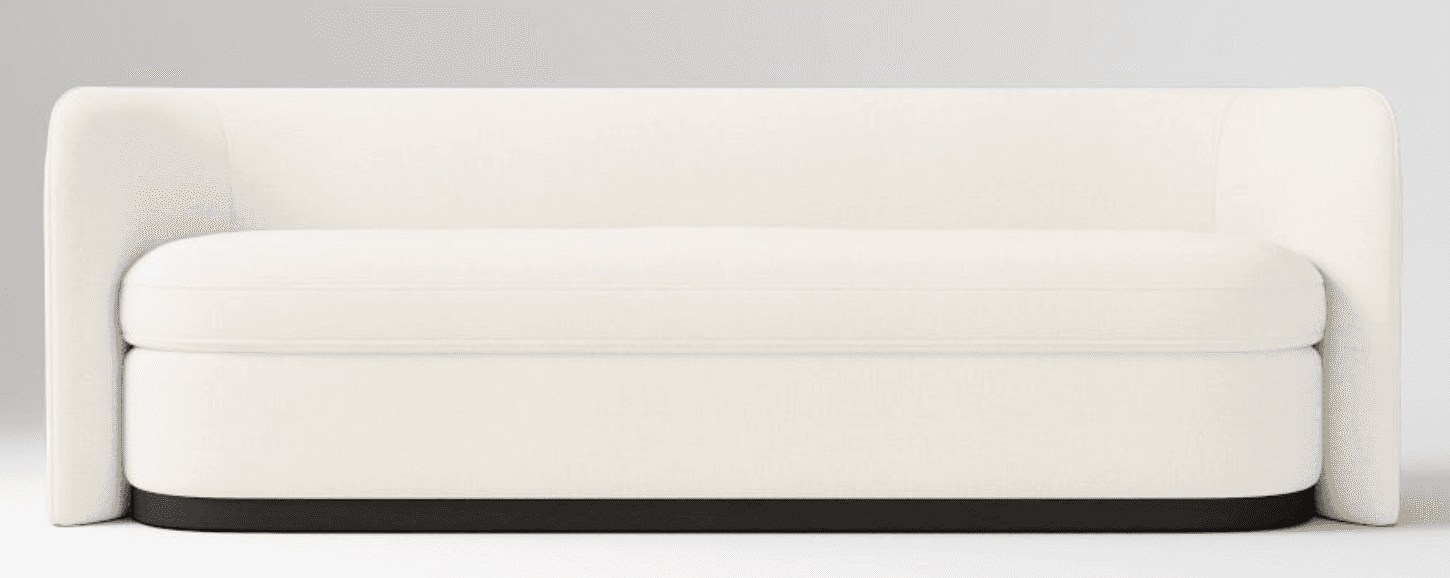 A contemporary loveseat upholstered in a light, off-white fabric, featuring a minimalist design. It… — 3D model