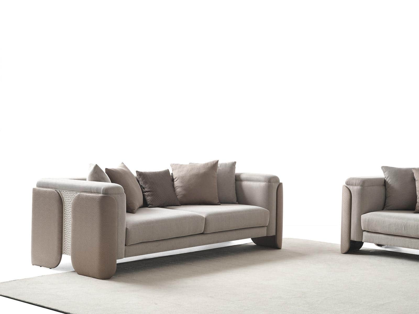 A contemporary three-seater sofa upholstered in a light greige fabric with distinctive wide, padded… — 3D model