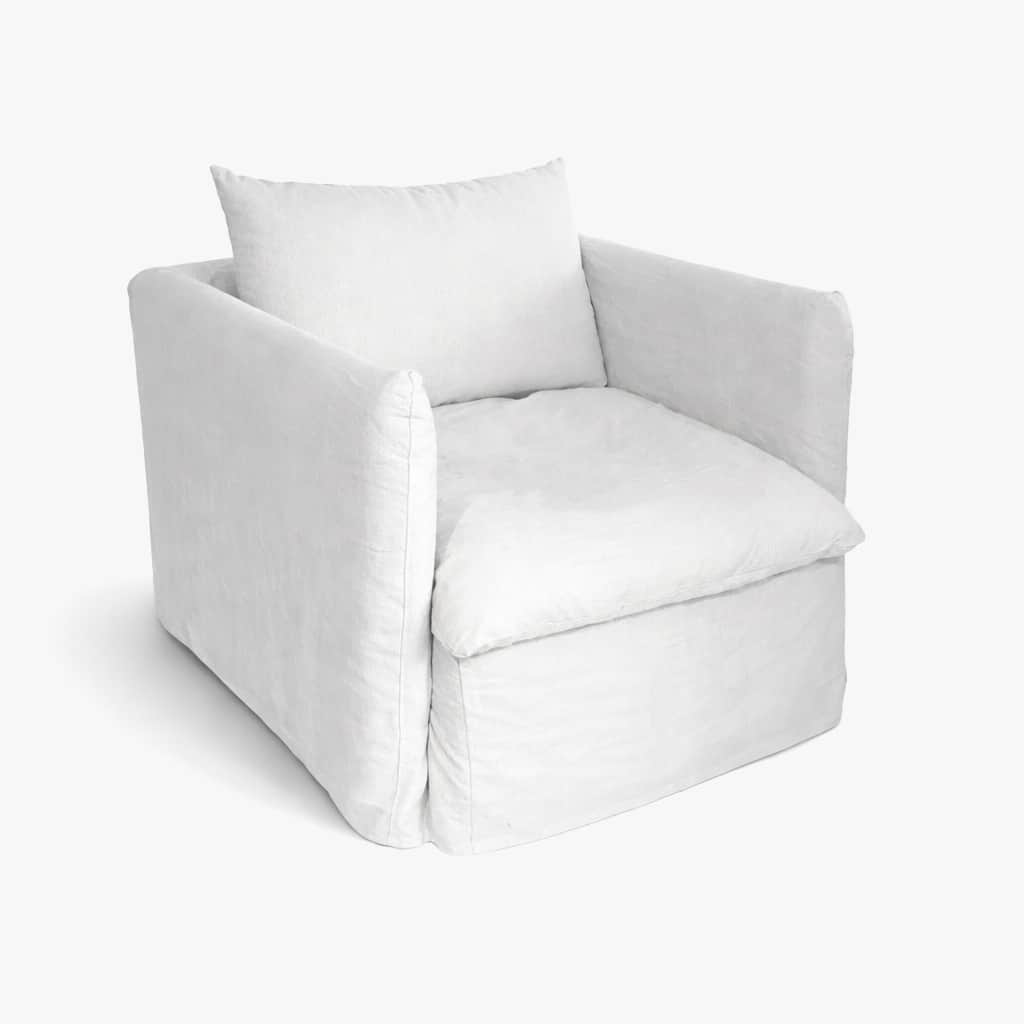 A white slipcovered armchair with a square silhouette. It features a single seat cushion and a back… — 3D model