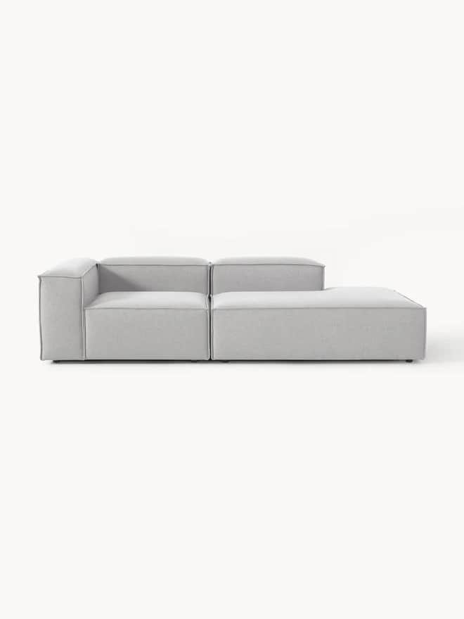 A modular sofa composed of two distinct sections placed side-by-side. The left section is an armless… — 3D model