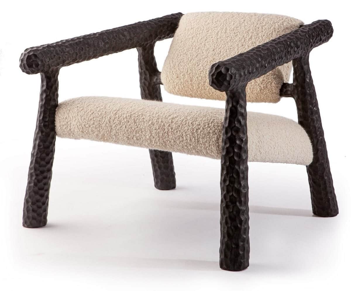 An armchair with a distinctive sculpted frame and upholstered seating and backrest. The frame elemen… — free OBJ 3D model