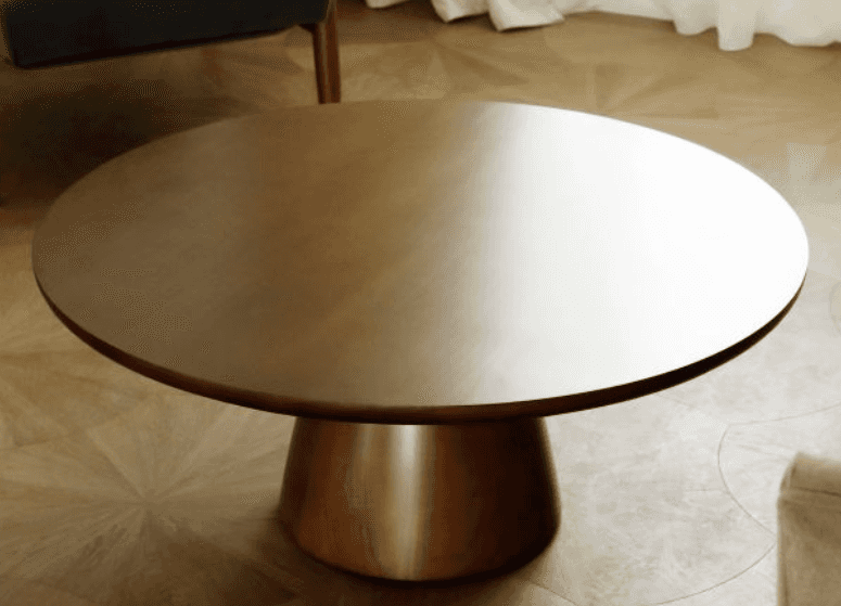A robust, round coffee table featuring a thick, circular top and a substantial, tapering pedestal ba… — 3D model