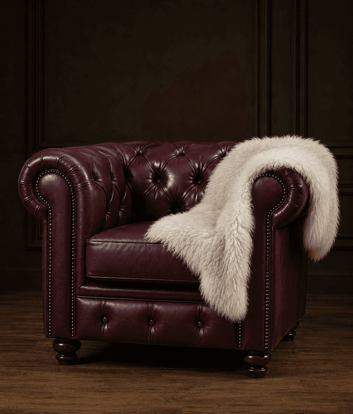 A classic Chesterfield-style armchair, upholstered in rich burgundy leather, featuring deep button t… — 3D model